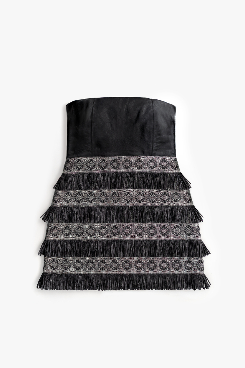 Mini cocktail dress in black nappa leather. Designer strapless mini dress featuring a corset bodice and raffia-ornamented skirt.